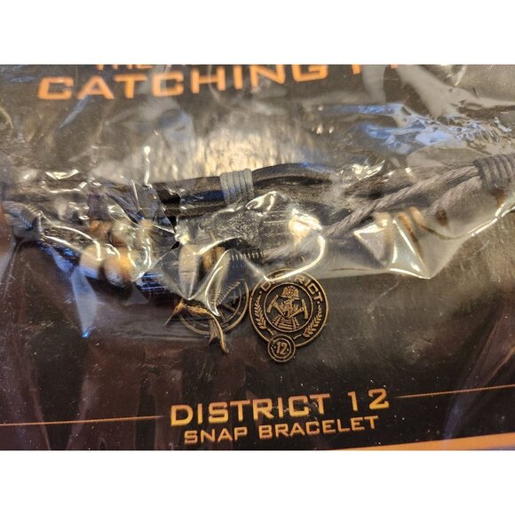 The Hunger Games Catching Fire District 12 Snap Bracelet By NECA - Picture 2 of 4